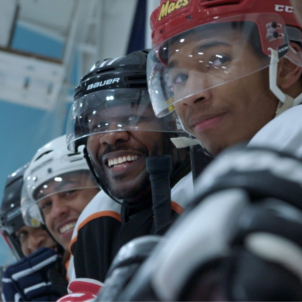 ICE BREAKERS Shot of a group of young boys sitting on the hockey bench.